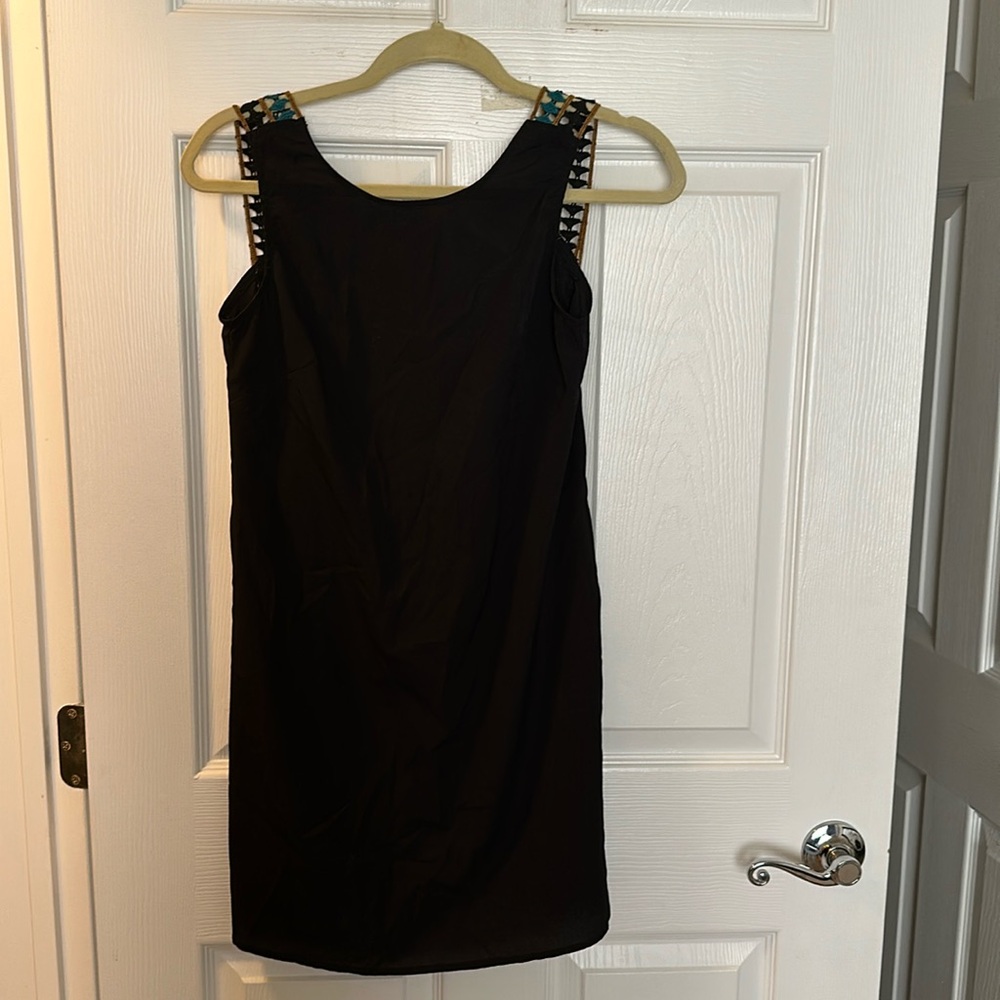 Little black backless dress with embroidery detail